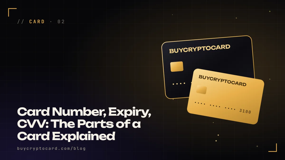 A black metal card with gold labels pointing to its number, expiry and code